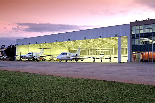 Airplanes parked on the ramp and in the hangar